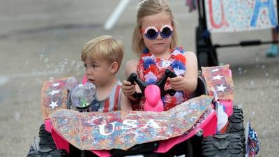 Kids show their rides and patriotic colors at Let Freedom Ring Kiddie Parade