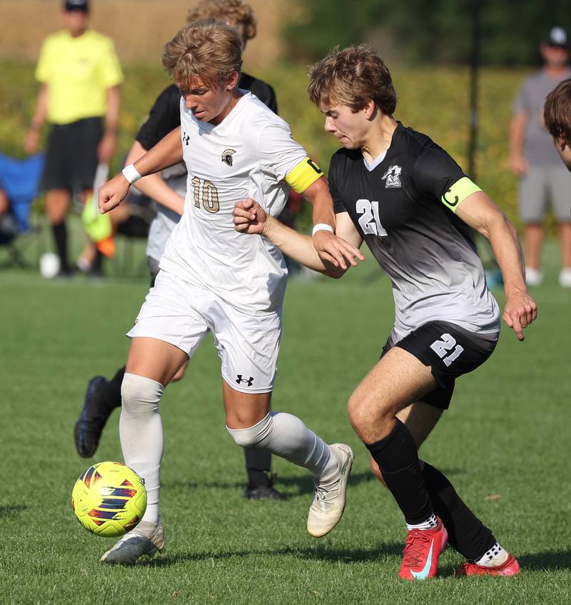 Sycamore's Gavin Crouch (left) pushes the ball ahead of Kaneland's Jackson Boryc during their game Wednesday, Sept. 16, 2025, at Kaneland High School in Maple Park.