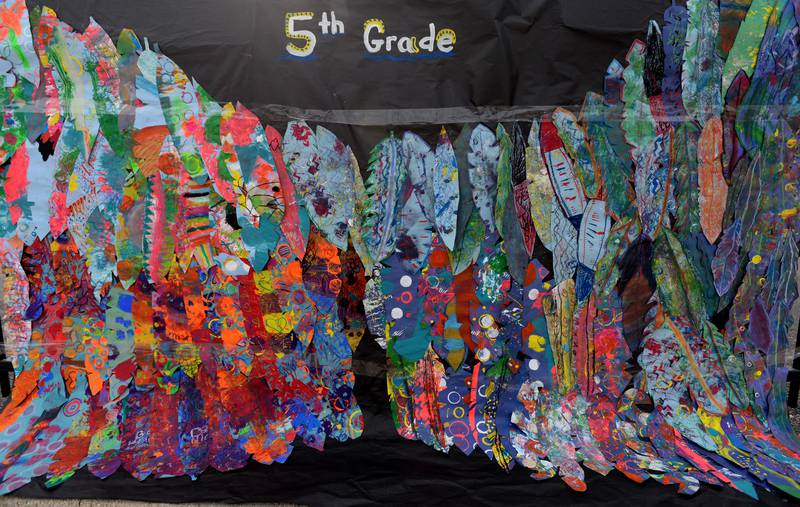 Students' art work is displayed along the fence of Jefferson Elementary School during District 98's Dia de los Niños celebration held Friday April 29, 2022.