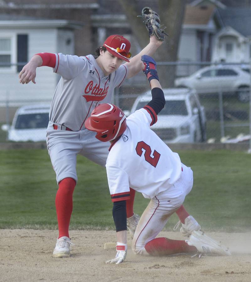 Streator’s Zander McCloskey is out at second on a stolen base attempt after Ottawa’s Jace Veith applies the tag in the second inning Thursday at Streator.
