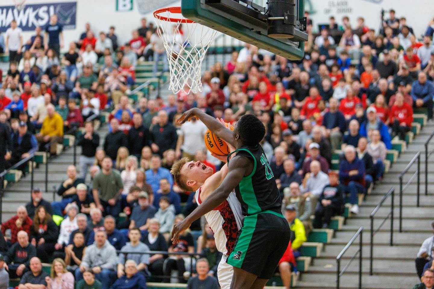 Glenbard East's Danny Snyder is would by York's Nathan Poku at the Class 4A Bartlett Sectional Final on Friday, March 6,2026 in Bartlett.