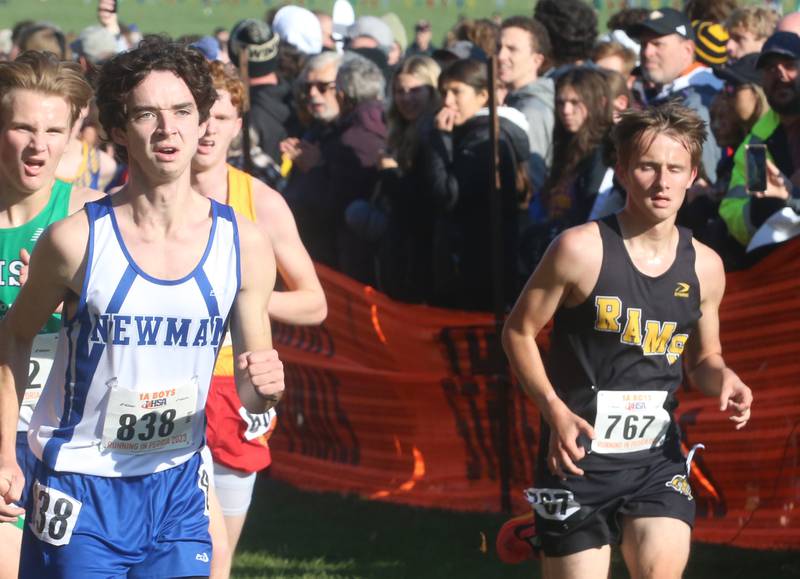 Newman's Carver Grummert and Riverdale's Gage Gaulrapp compete in the Class 1A State Cross Country race on Saturday, Nov. 4, 2023 at Detweiller Park in Peoria.