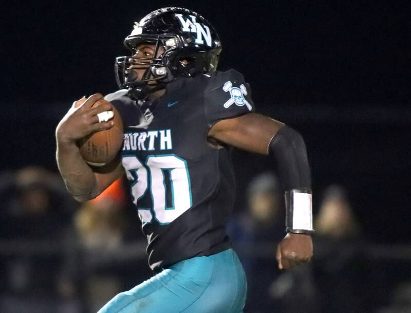 Woodstock North’s David Randecker sprints for a long touchdown run against Freeport in first-round IHSA Playoff football action on Saturday, Nov. 2, 2024 at Woodstock North High School in Woodstock.