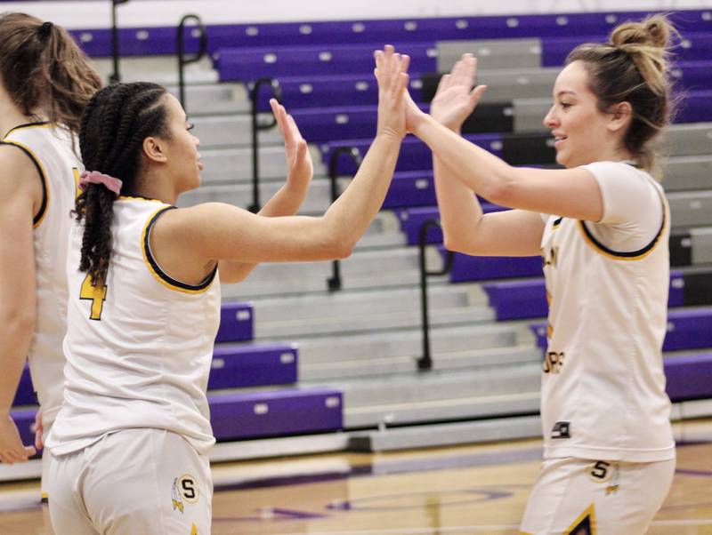 Sterling's Olivia Turner (4) exchanges a double high-five with Aubri Menchaca (1) on Wednesday. Turner was fouled while scoring on a fastbreak layup. Turner had 11 points. Rockford Jefferson beat Sterling 41-37 at the Dixon KSB Holiday Classic.