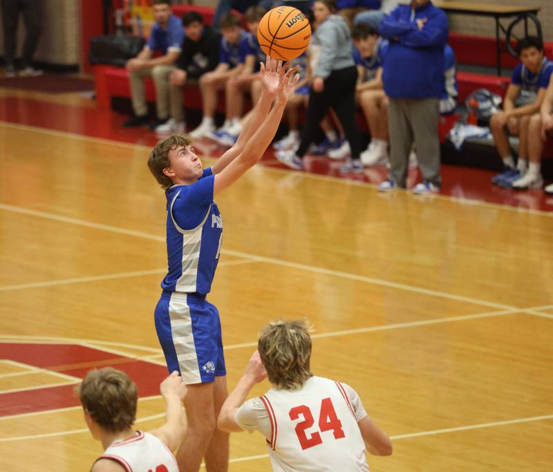 Princeton's Jackson Mason shoots a jump shot over Ottawa's George Shumway during the Dean Riley Shootin' The Rock Thanksgiving Tournament on Monday Nov. 24, 2025 in Kingman Gymnasium at Ottawa High School.