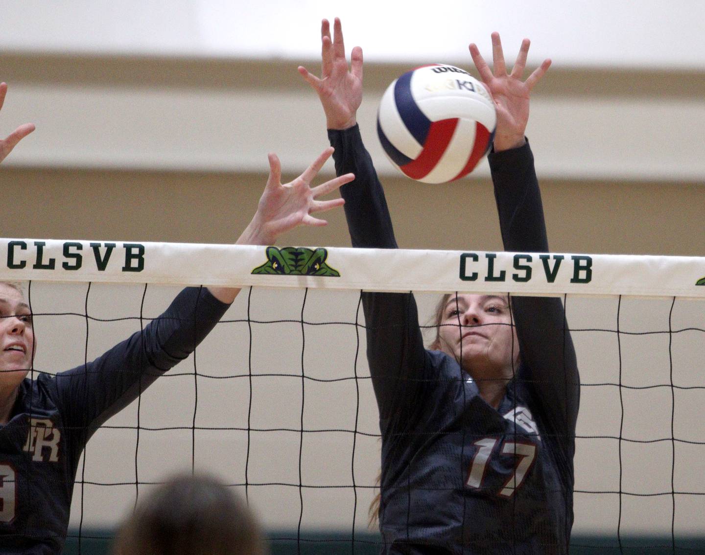 Prairie Ridge’s Mackenzie Schmidt blocks in varsity volleyball at Crystal Lake South Tuesday night.