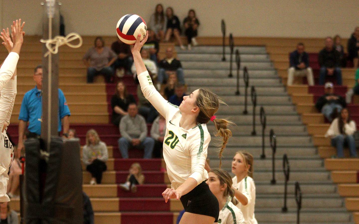 Crystal Lake South’s Morgan Johnson sends the ball over the net in varsity volleyball at Huntley Tuesday.