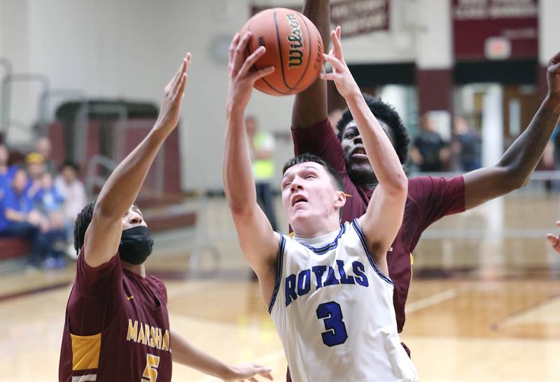 Hinckley-Big Rock's Ben Hintzsche gets a layup in front of two Chicago Marshall defenders Wednesday, March 1, 2023, during their Class 1A sectional semifinal matchup at Elgin High School.