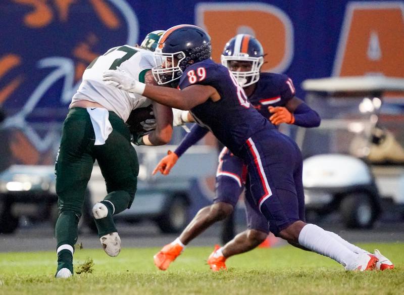 Oswego’s Taiden Thomas (89) chases Plainfield Central's Mason Smith (17) during a football game at Oswego High School on Friday, Sept. 8, 2023.