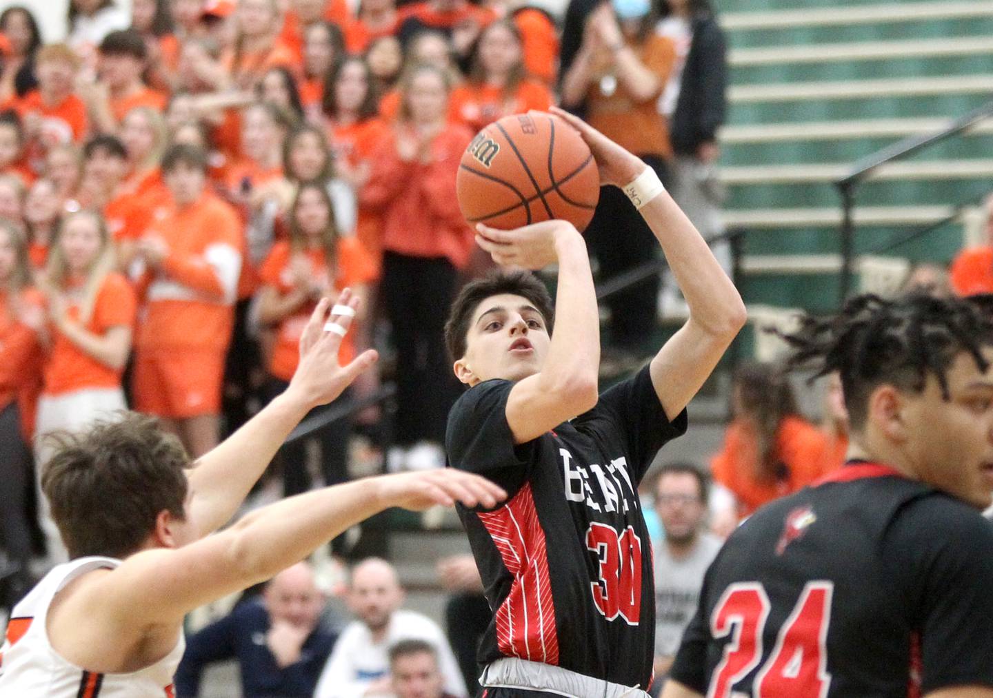 Benet’s Nikola Abusara (30) shoots the ball during a Class 4A Bartlett Sectional semifinal game against Wheaton Warrenville South on Wednesday, March 2, 2022.