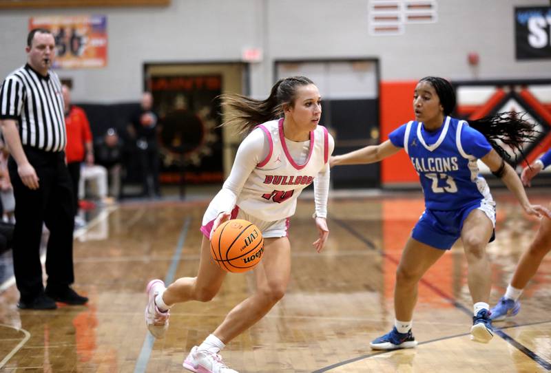 Batavia's Payton Haslett drives toward the basket during a Class 4A St. Charles East Sectional semifinal against Wheaton North on Tuesday, Feb. 25, 2025 in St. Charles.