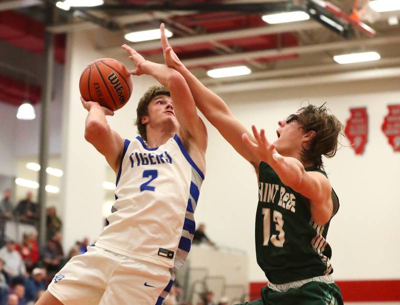 Princeton's Teegan Davis shoots over St. Bede's Landon Jackson Saturday night.