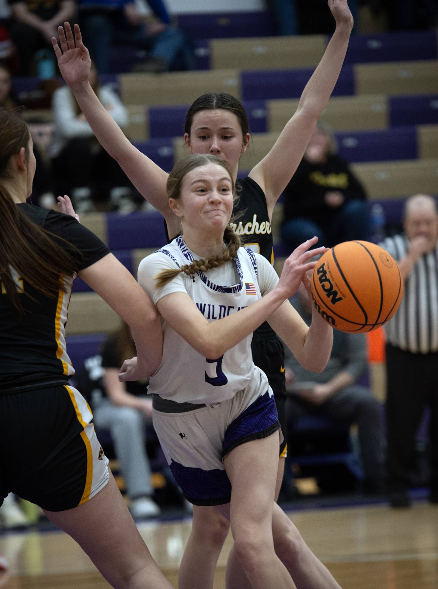 Wilmington's Keeley Walsh passes off the ball as Herscher's Laney Mohler tightly guards in a game on Thursday, January 29, 2026.