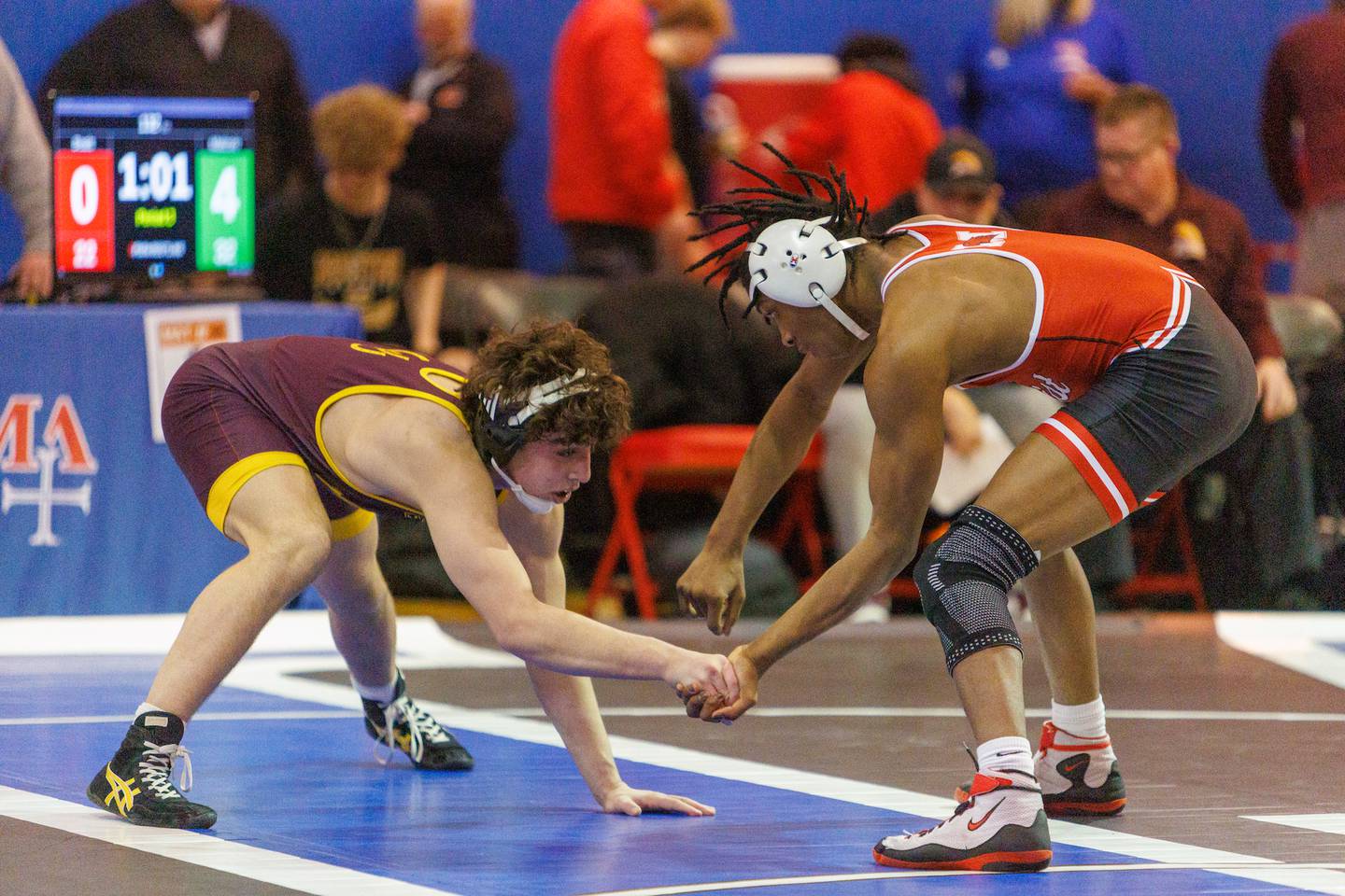 Montini's Mikey Malizzio and Marist's Te' Jon Beals competes in the 132 lb match  at the Marmion Class  2A Dual Team Sectional on Thursday, Feb. 5,2026 in Aurora.