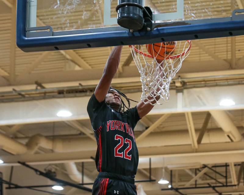 Yorkville's Braydon Porter (22) dunks during their Class 4A Naperville North Regional final basketball game between Yorkville at Downers Grove South, Feb 27, 2026 in Naperville.