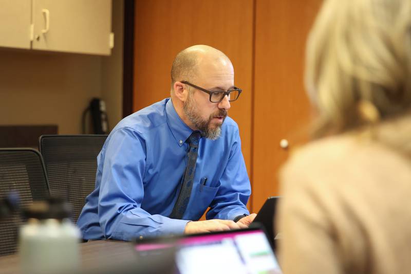 Tim Albores, Director of Student Services for High School and ED/Alternative Programs, collaborates with other administrators at the Plainfield Community Consolidated School District 202 building on Wednesday, March 14th, 2023 in Plainfield.