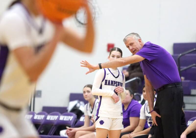Hampshire’s Head Coach Eric Samuelson offers guidance to Peyton McCarthy against Sycamore in varsity girls basketball on Friday, Jan. 3, 2025, at Hampshire High School in Hampshire.