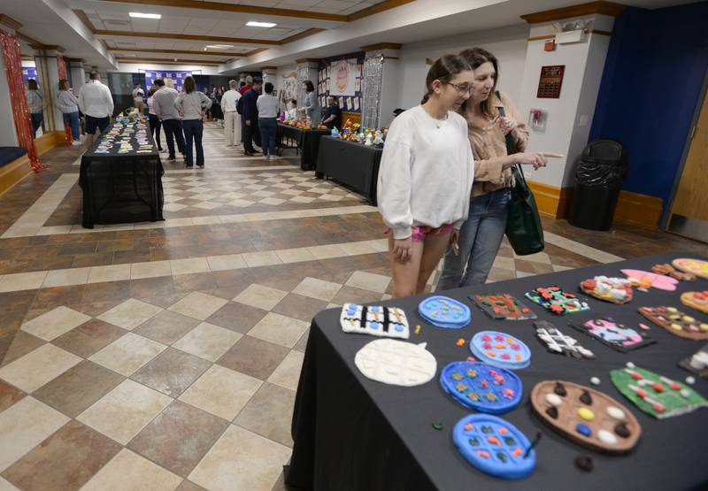Nazareth parent (right) Michelle Udelson of Riverside and her daughter Mallory look at some of the art works created by all the art classes including Michelle's daughter (to shown) during the Expressive Arts Showcase held Monday, April 8, 2024.