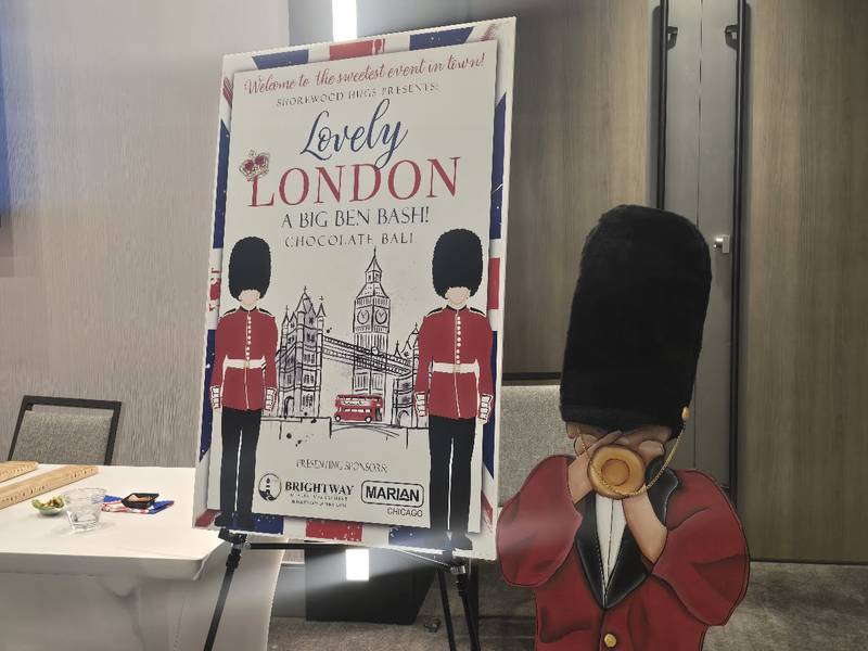 Guests entering the Shorewood HUGS' "Lovely London: A Big Ben Bash" 2026 chocolate ball fundraiser are greeted with a "king's guard" playing the bugle on Saturday, Feb. 7, 2026, at Hollywood Casino Joliet.