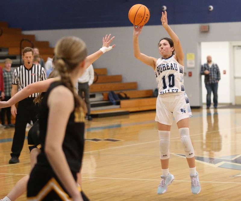 Bureau Valley's Maddie Wetzell sinks a shot over Riverdale defenders during the Thanksgiving Tournament on Wednesday, Nov. 20, 2024 at Bureau Valley High School.
