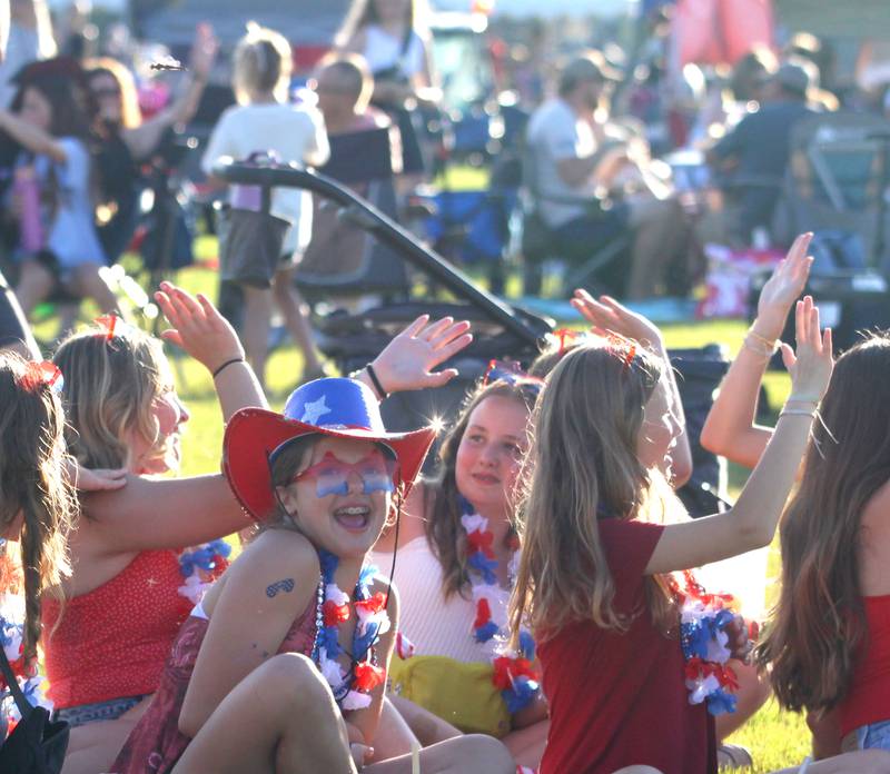 People enjoy the sounds of the Modern Day Romeos during the Stars N’ Stripes Fest at Cary-Grove Park in Cary on Saturday, June 28, 2025.