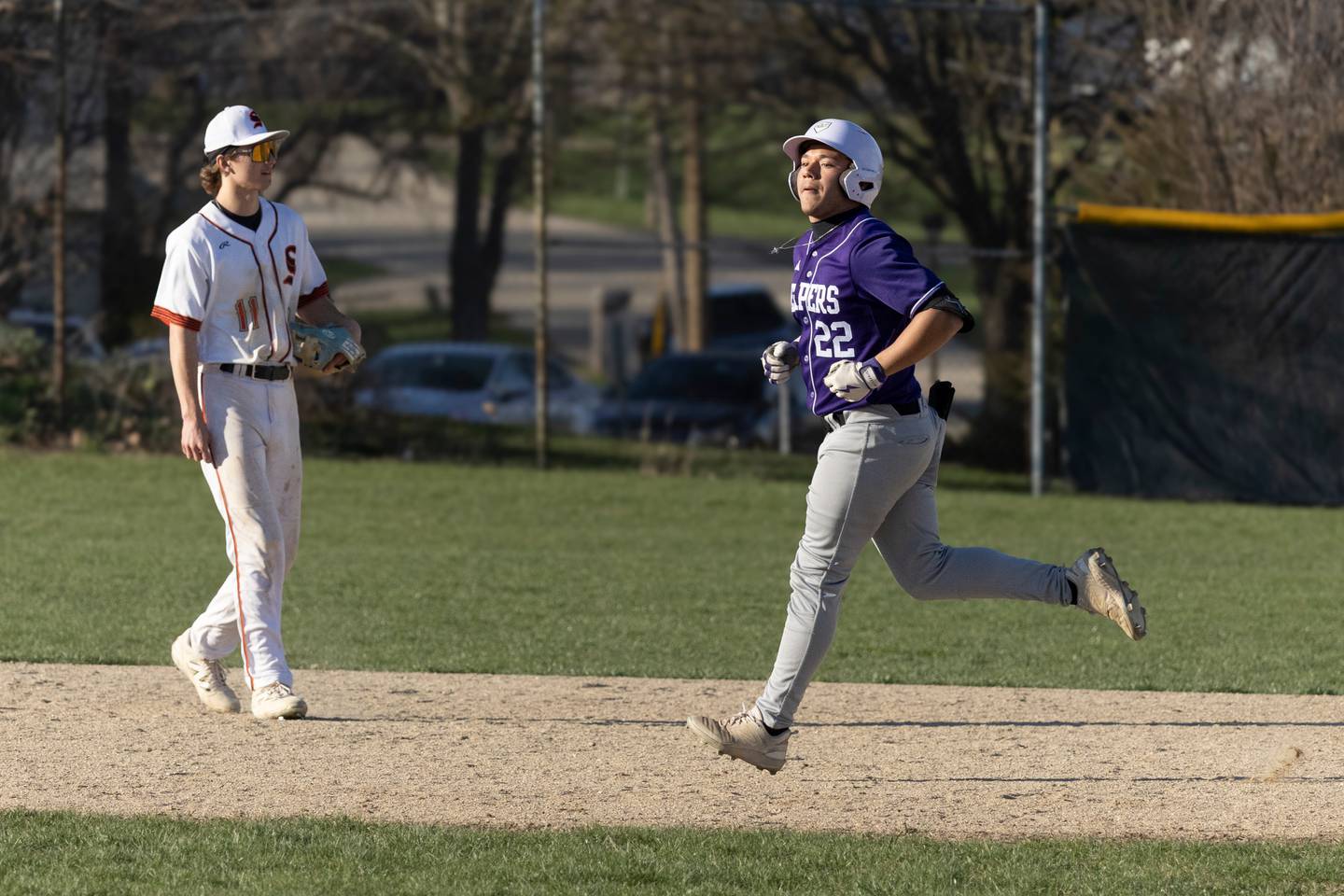 Plano's Brandon Ramos (22) circles the bases after his home run on Wednesday at Sandwich.