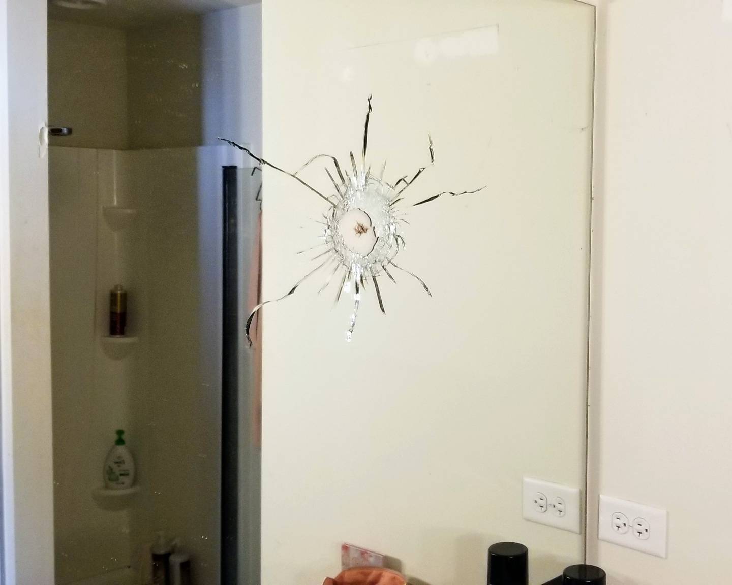 Gustavo Alanis’ home, which has a backyard that abuts a property where a shooting took place in Woodstock Monday, Jan. 24, 2022, was struck by a bullet that appeared to have traveled through the second story, shattering a bathroom mirror and damaging the wall next to a shower.