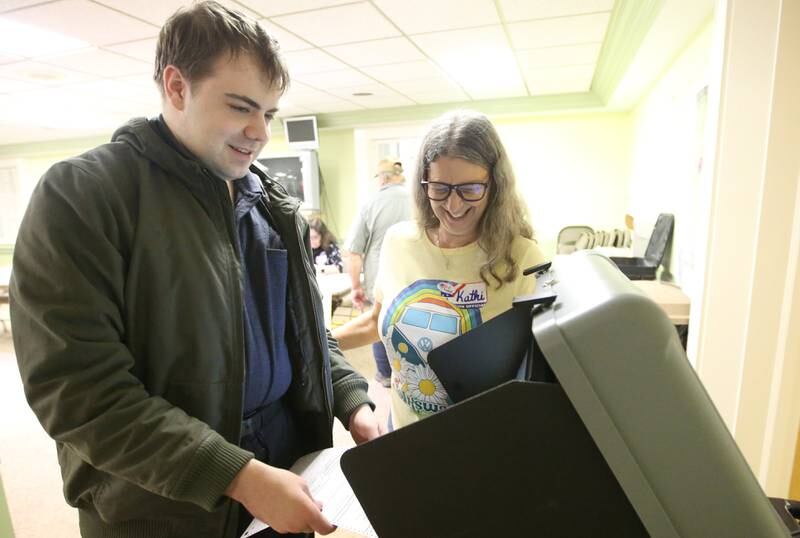 Stephen Vlastnick casts his ballot with election judge Kathy Zeman on Tuesday, Nov. 5, 2024 at Zion United Church of Christ in Peru.