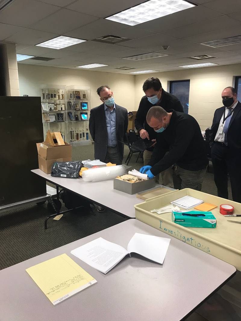 The first batch of evidence from the Starved Rock murders case is readied for lab transfer Thursday, Dec. 9, 2021, with (from left) Chester Weger's attorney Andy Hale, forensic scientist Chistopher Palenik, Investigator Tyson Szafranski and deputy special prosecutor Christopher Koch.
