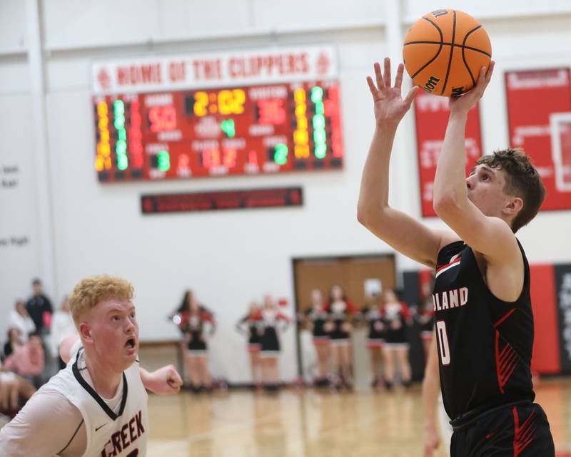 Woodland's Noah Decker eyes the hoop over Indian Creek's Isaac Willis during the Class 1A Sectional Semifinal game on Wednesday, March 4, 2026 at Amboy High School.