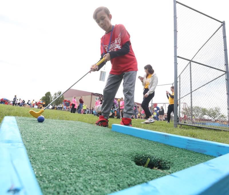 Thomas R. of Centenial School in Streator mini puts during the Wallace Warrior Games on Friday, May 8, 2026 at Wallace Grade School. The unified event promoted inclusiveness, friendships and fun. 25 schools and over 400 kids from La Salle, Bureau and Putnam Counties participated in the event.