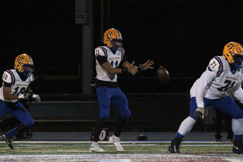 Crete-Monee's Derrin Couch receives the snap during the Warriors' victory over the Kays on Friday, Oct. 24, 2025