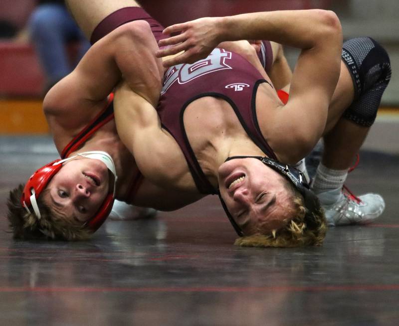 Huntley’s Matt Keaty, left, battles Prairie Ridge’s Andrew Cioper at 144 pounds in varsity wrestling on Thursday, Jan. 23, 2025, at Huntley High School in Huntley.