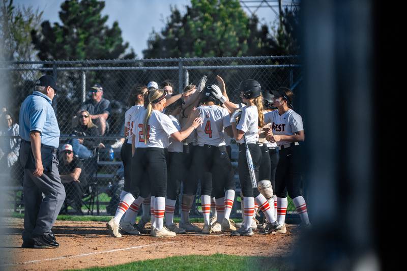 Lincoln-Way West celebrates Olivia Calderone's home run during a game against Plainfield Central on Friday May 3, 2024 at Lincoln-Way West in New Lenox