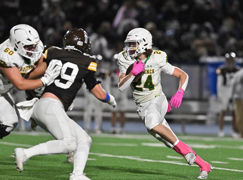 Providence Catholic's Broden Mackert (24) rushes the ball during the conference game against Joliet Catholic on Friday, OCT. 24, 2025, at Joliet.