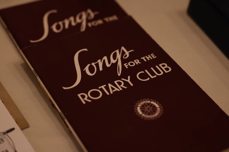 A song book sits on display at a luncheon to celebrate the 110th anniversary of the Rotary Club at Jacob Henry Mansion on Tuesday, Aug. 1 in Joliet.