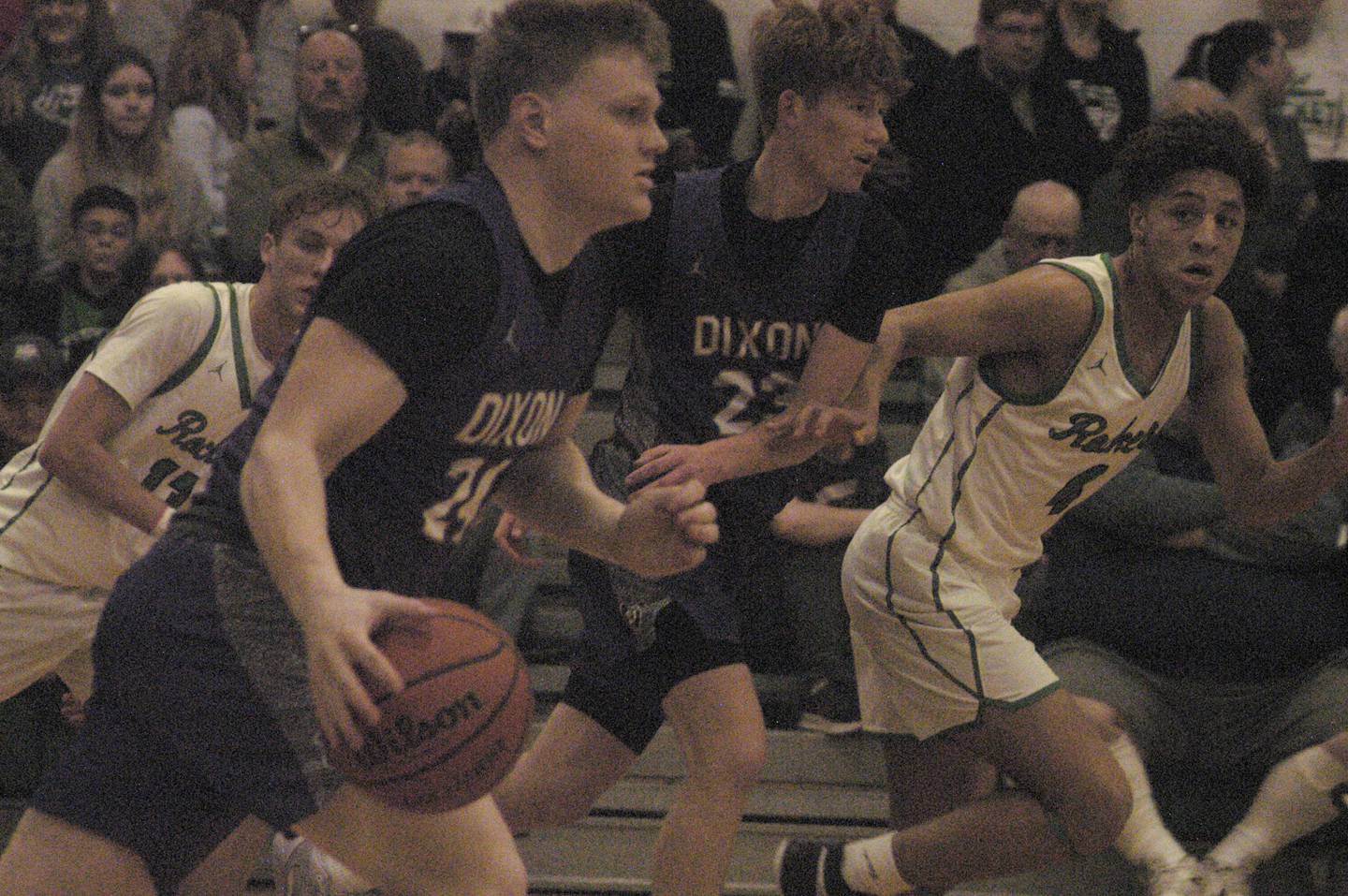 Dixon's Eli Davidson brings the ball upcourt against Rock Falls during their game Tuesday, Feb. 6, 2024, at Rock Falls High School.