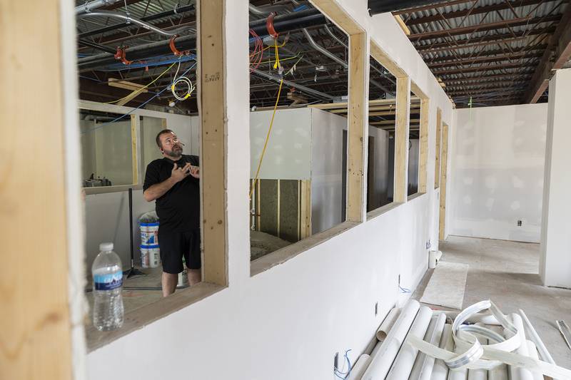 Rocky McGowan talks about the renovation happening in the former Amcore Bank building in downtown Sterling Thursday, July 10, 2025. McGowan’s business M5 is doing all the renovations other than roof work.