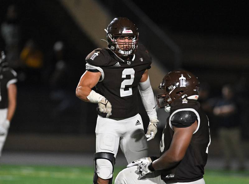 Joliet Catholic's teammate giving instructions to the defense during a non-conference game against St. Rita on Friday, Sep. 08, 2023, at Joliet. (Dean Reid for Shaw Local News Network