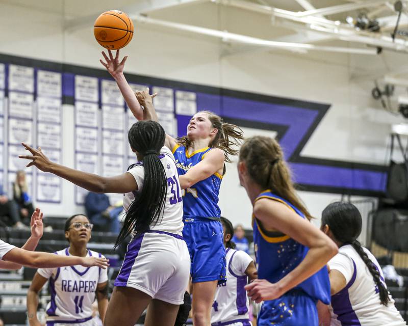 Johnsburg's Summer Toussaint (14) goes up for a lay up during their basketball game between Johnsburg at Plano, Monday Dec 16, 2024 in Plano.