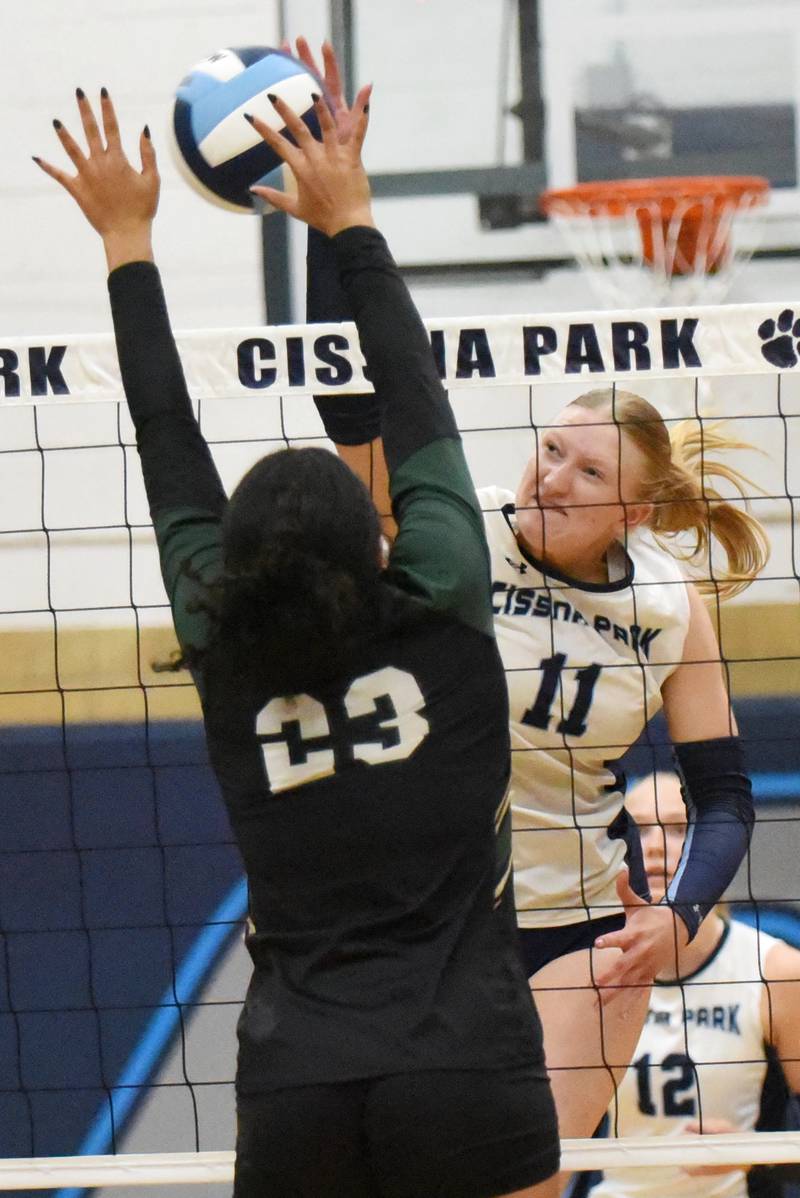 Cissna Park's Sophie Duis, right, sends the ball over the net as Bishop McNamara's Journey Slone looks to block during a game at Cissna Park Wednesday, Oct. 15, 2025.