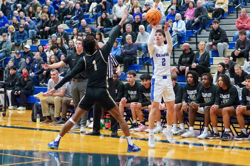 Geneva’s Gabe Jensen (2) shoots a 3-pointer against Glenbard North's Lamari Carpenter (1) during a class 4A Geneva Regional final basketball game at Geneva High School on Friday, Feb. 28, 2025.