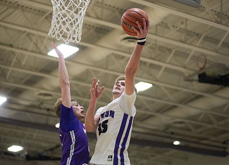 Dixon's Jacob Gaither puts up a shot against Rochelle Wednesday, Feb. 23, 2022 during a semifinal regional game.