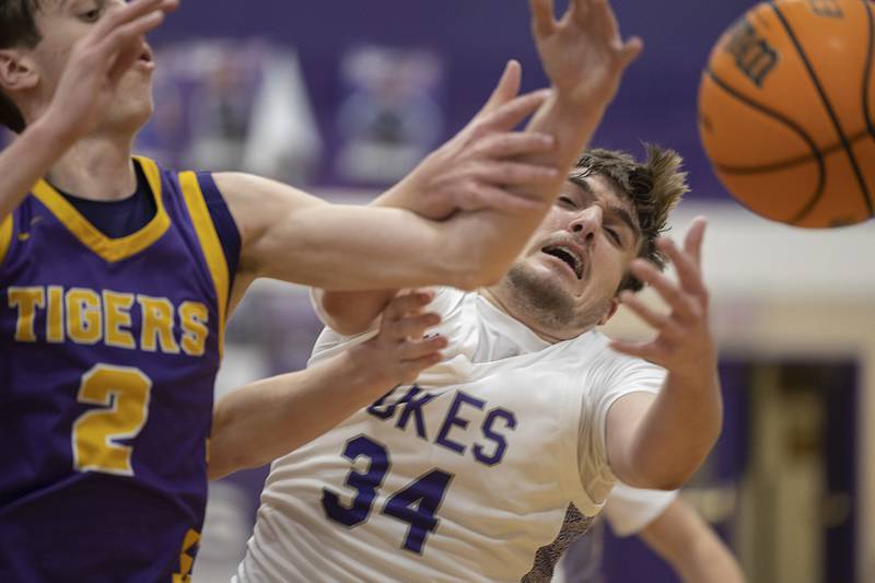Dixon’s Jakob Nicklaus works in the paint against Sherrard’s Brylan Bender Friday, Feb. 20, 2026.