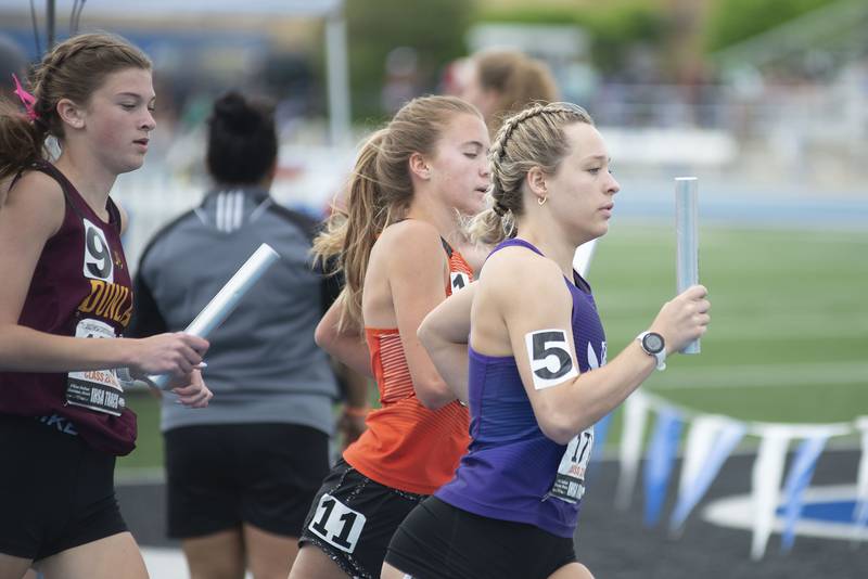 Dixon's Emma Smith runs the first leg of the 2A 4x8 finals during the IHSA girls state championships, Saturday, May 21, 2022 in Charleston.