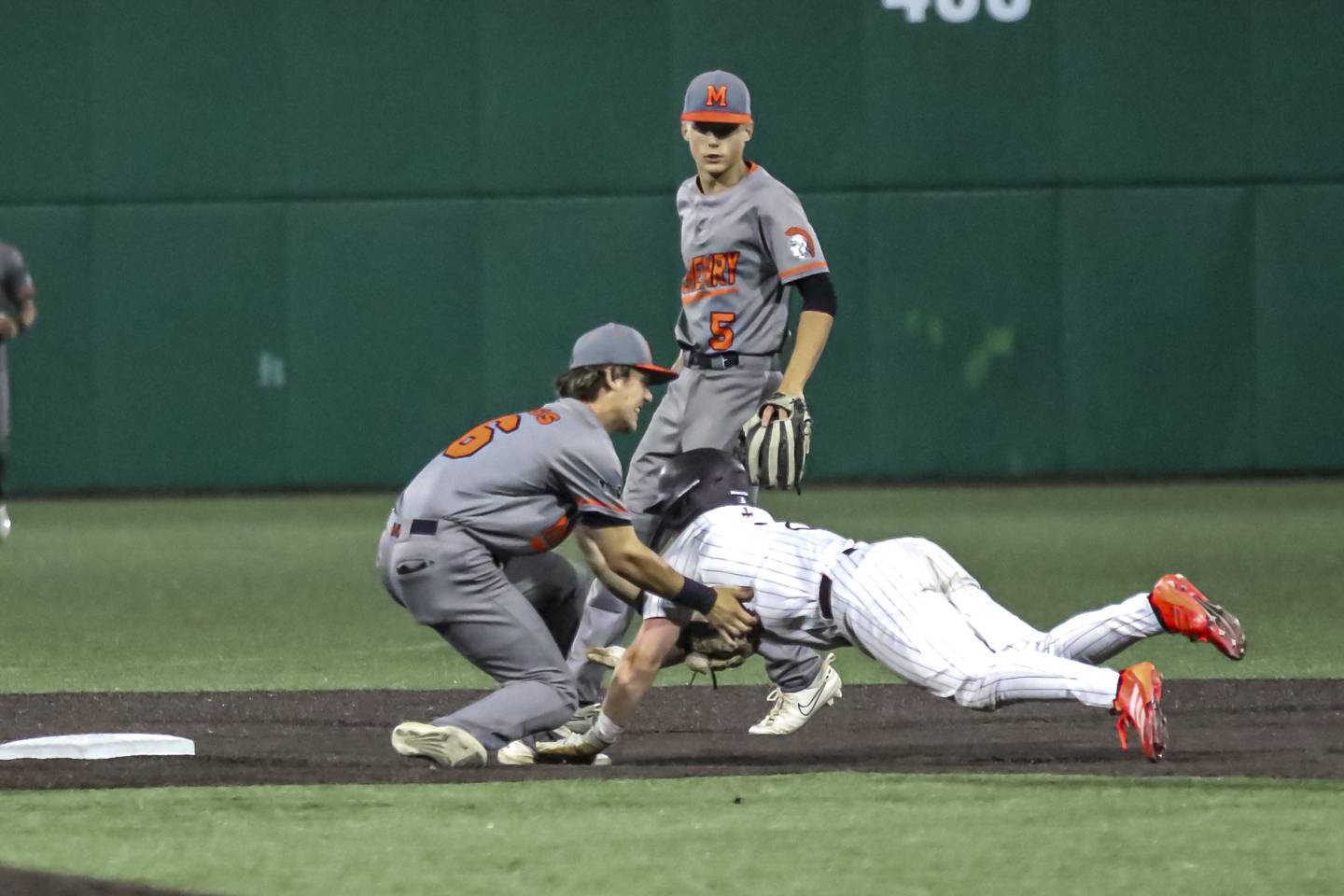 McHenry's Kyle Maness (16) tags the runner out at second to end a rundown Monday, June 13, 2025, in Joliet.