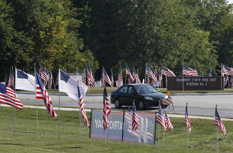 American flags, put up by True Patriots Care, surround McHenry Township Fire Protection District Station 2 on Johnsburg Road in Johnsburg on Thursday, Sept. 11, 2025. The Flags of Honor is on  display at Station 2 through September 15. This exhibit honors the 343 brave firefighters who lost their lives during the tragic events of September 11, 2001, with each flag symbolizing their courage and sacrifice.