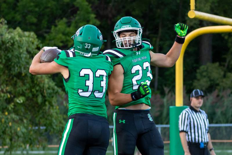 (from left) Cameron Shriey (33) of Seneca celebrates touchdown with teammate Brady Sheedy (23) on Friday, Aug 29, 2025 at Seneca High School in Seneca.
