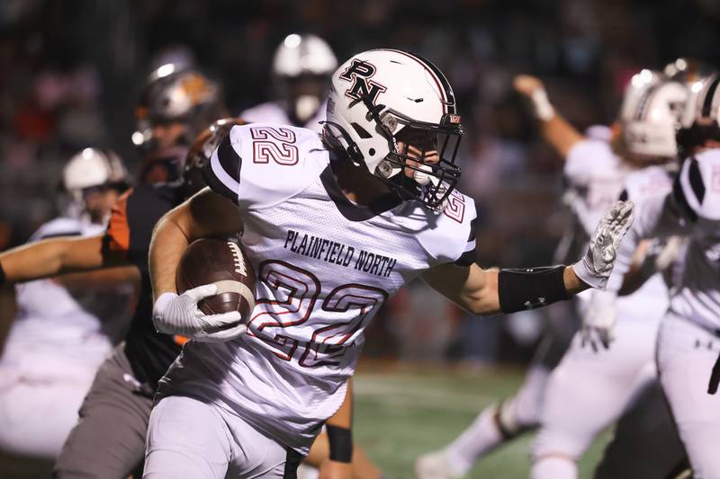 Plainfield North’s John St. Clair rushes to the outside against Minooka. Friday, Oct. 7, 2022, in Minooka.