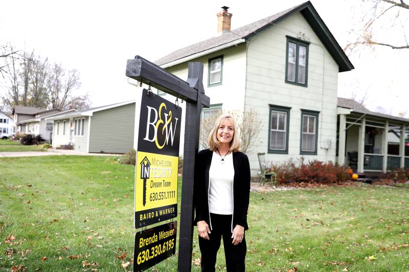 Realtor Brenda Weaver outside a home in Plano, which is currently listed for sale.